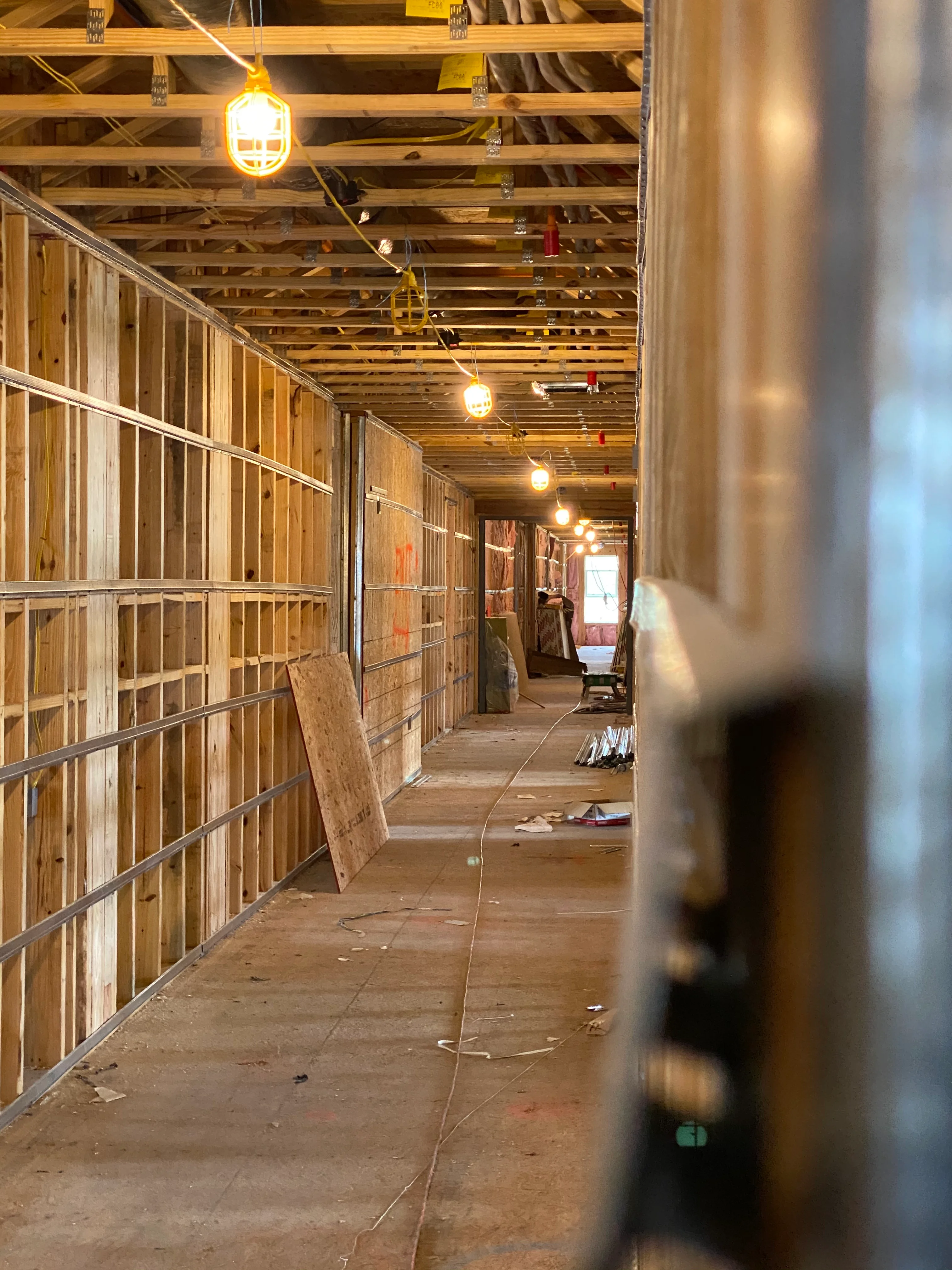 General contractor team reviewing construction plans on job site